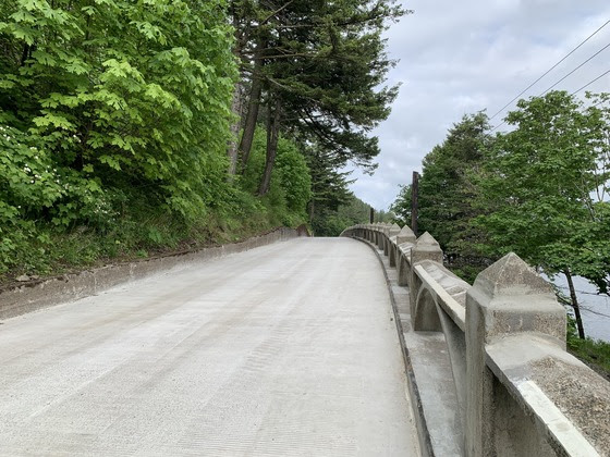 The viaduct on the Historic Highway after repairs/renovations, trees line the side of the roadway